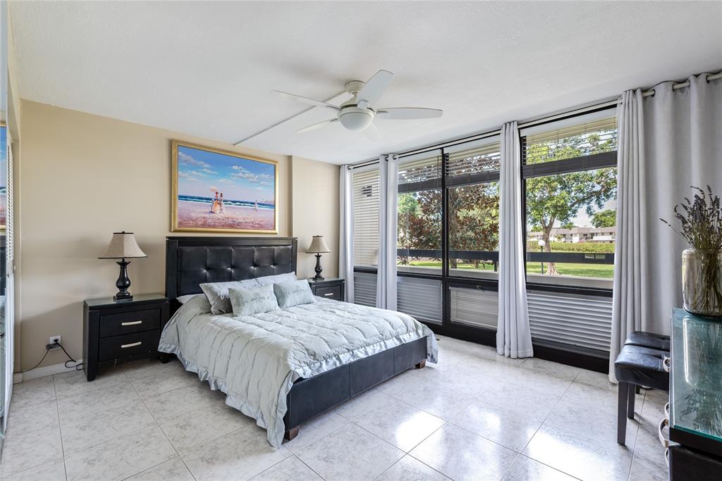 1401 South Federal Highway, Unit 122 Boca Raton, FL 33432 - Photo 19 of 29 a bedroom with a bed and a dresser next to a window