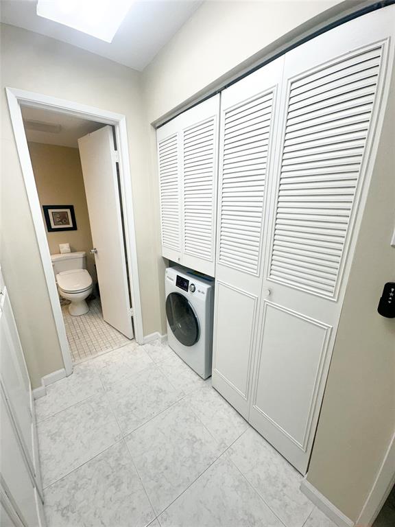 1401 South Federal Highway, Unit 122 Boca Raton, FL 33432 - Photo 22 of 29 a view of a storage and utility room with a washer dryer