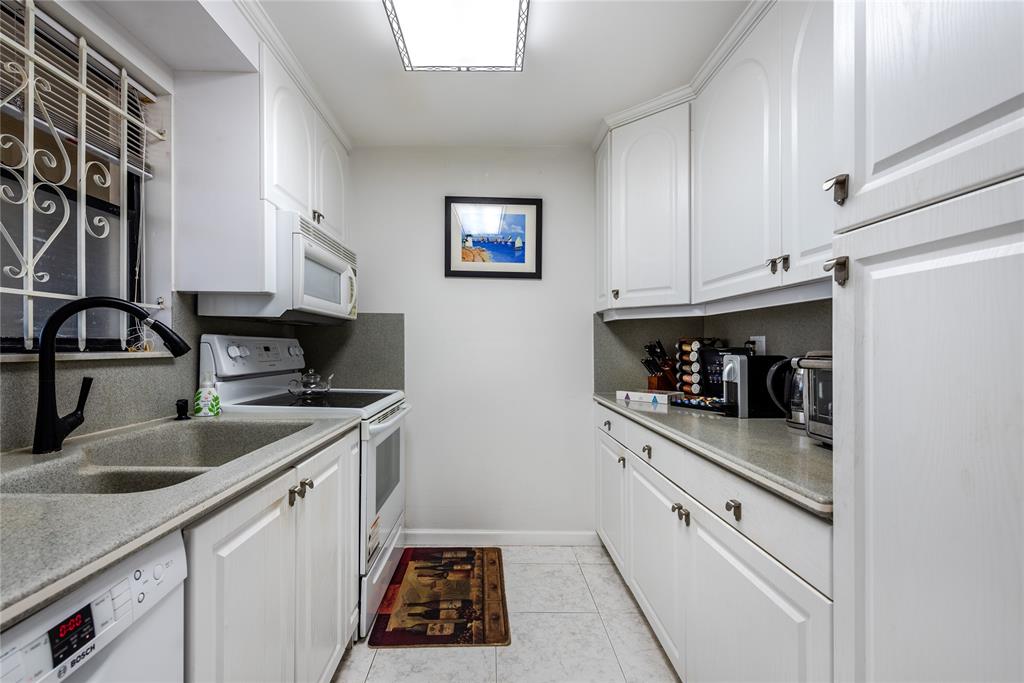1401 South Federal Highway, Unit 122 Boca Raton, FL 33432 - Photo 4 of 29 a kitchen with stainless steel appliances granite countertop a sink stove and cabinets