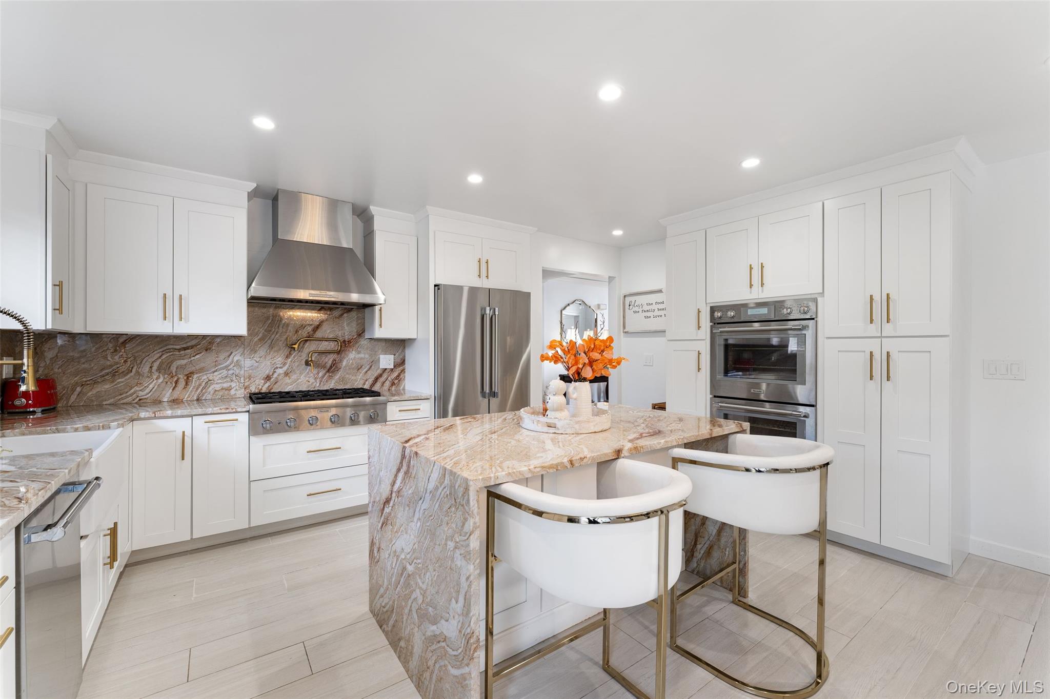 6 Hunting Ridge Road White Plains, NY 10605 - Photo 10 of 32 a kitchen with stainless steel appliances kitchen island granite countertop a sink and cabinets