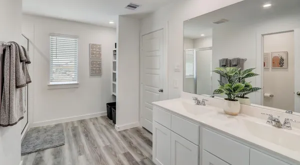a bathroom with a sink a faucet and a mirror