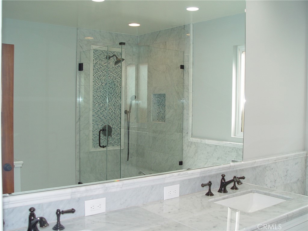 125 7th Street Manhattan Beach, CA 90266 - Photo 12 of 20 a bathroom with a bathtub and a sink