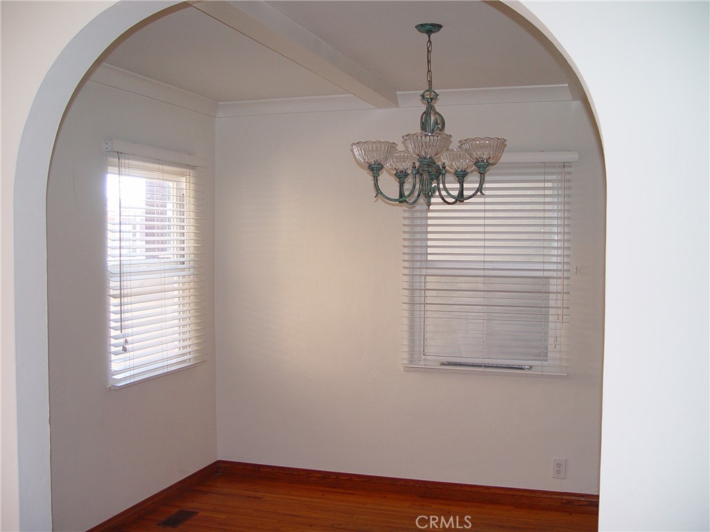 125 7th Street Manhattan Beach, CA 90266 - Photo 6 of 20 a view of a hallway with windows and chandelier