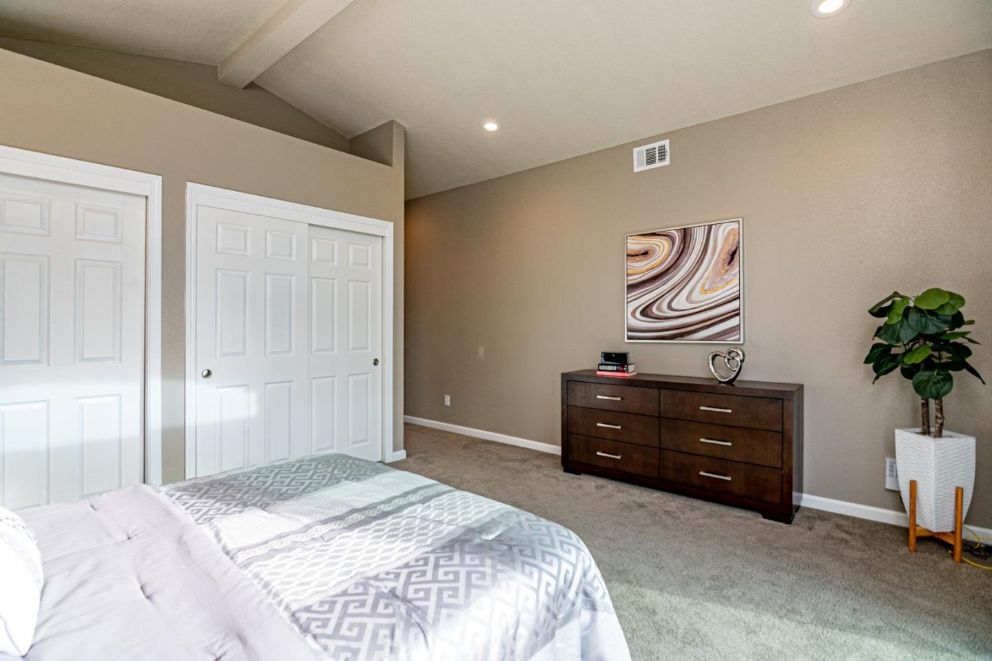 464 Greathouse Drive Milpitas, CA 95035 - Photo 14 of 27 a bedroom with a bed and a potted plant