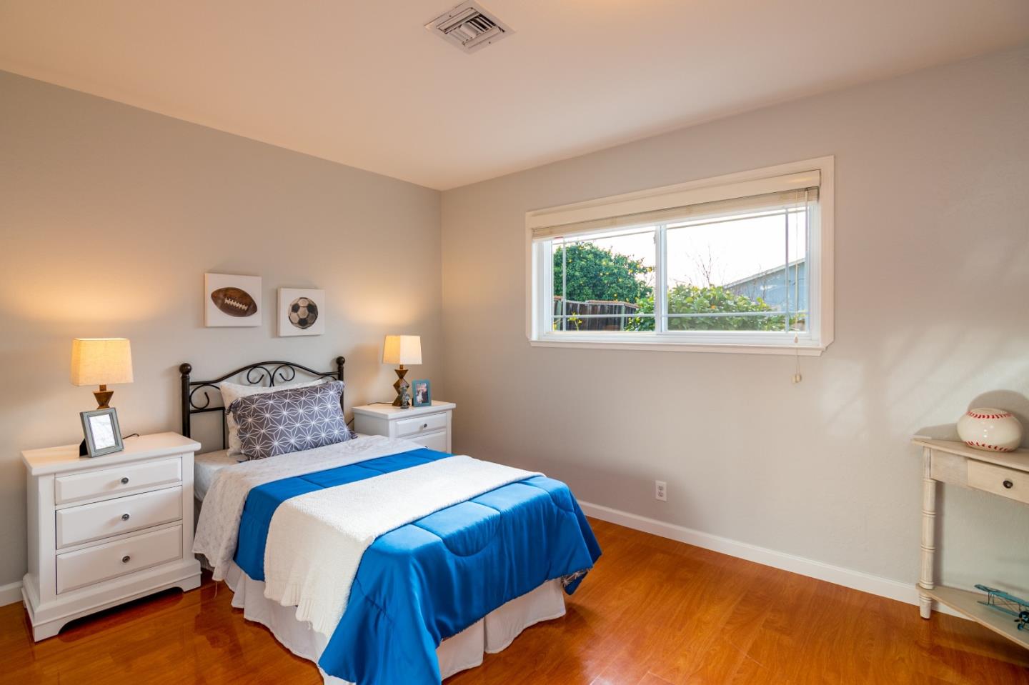 464 Greathouse Drive Milpitas, CA 95035 - Photo 19 of 27 a bedroom with a bed and a lamp