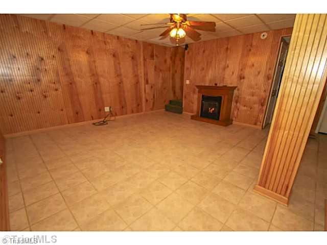 436 Farmstead Road Winston-Salem, NC 27107 - Photo 13 of 21 Den/Family/Great Room. Gorgeous finished Basement with gas log fire place and tile flooring