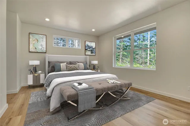 a bedroom with a large bed and a window