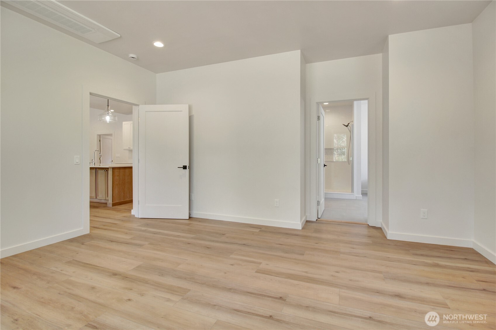 36817 State Rte 530 Northeast Arlington, WA 98223 - Photo 18 of 40 a view of an empty room with wooden floor and cabinet