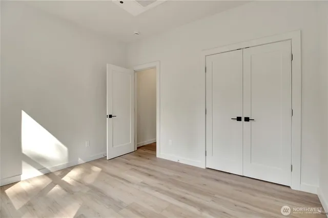 a view of a livingroom with wooden floor