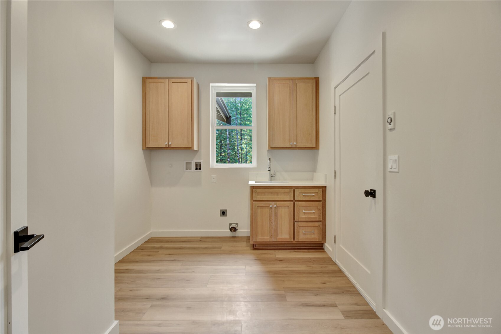 36817 State Rte 530 Northeast Arlington, WA 98223 - Photo 29 of 40 a view of a kitchen with a sink cabinets and wooden floor