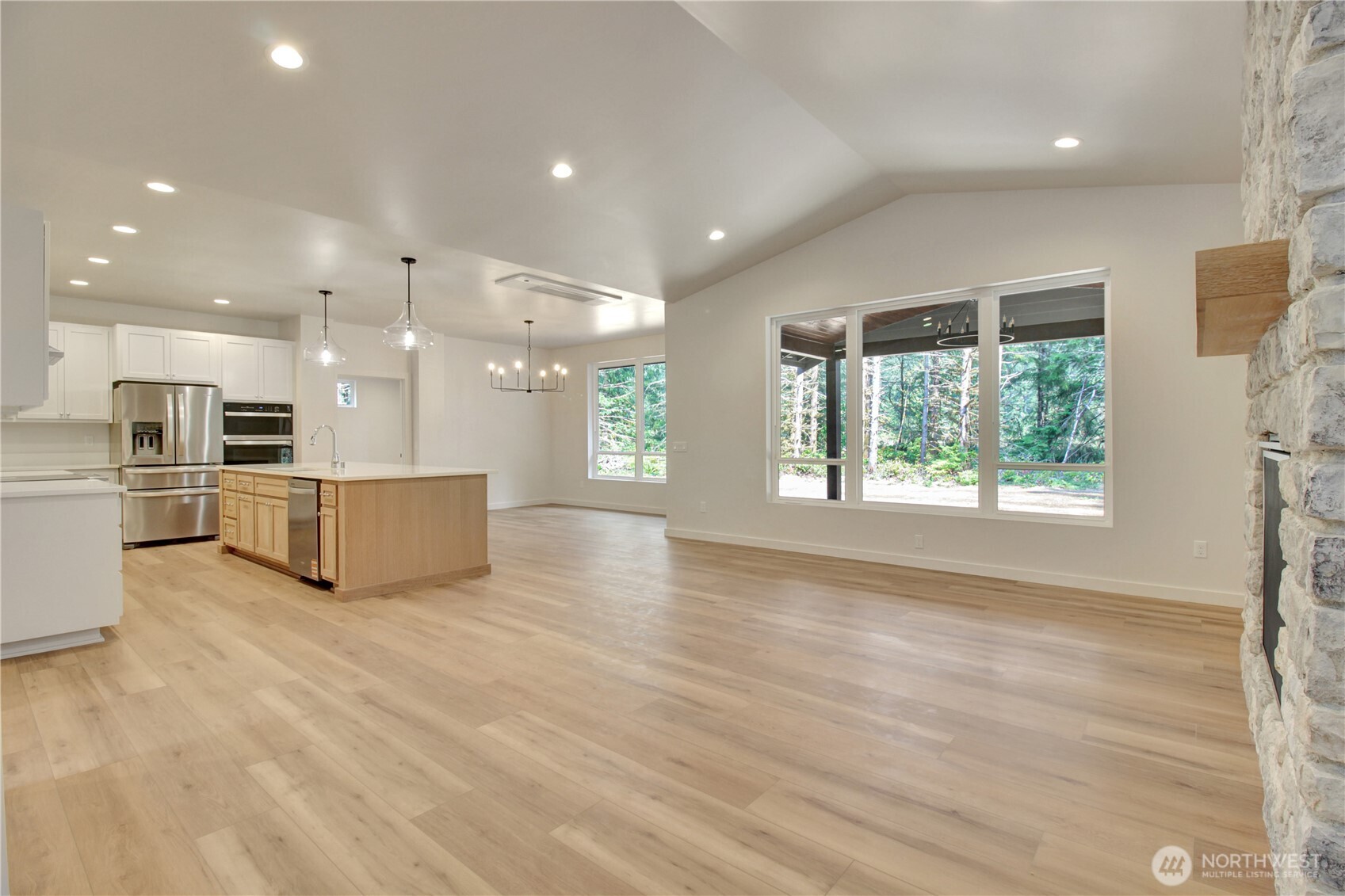36817 State Rte 530 Northeast Arlington, WA 98223 - Photo 3 of 40 a view of kitchen with kitchen island wooden floor appliances and cabinets