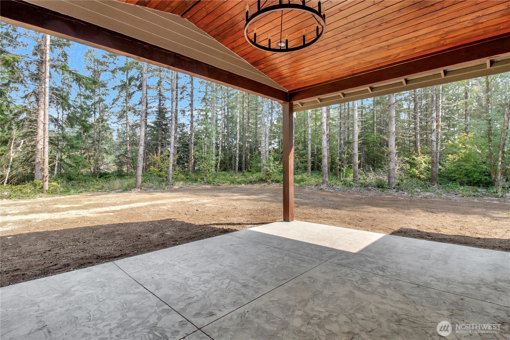 36817 State Rte 530 Northeast Arlington, WA 98223 - Photo 32 of 40 a swimming pool with large trees in front of it