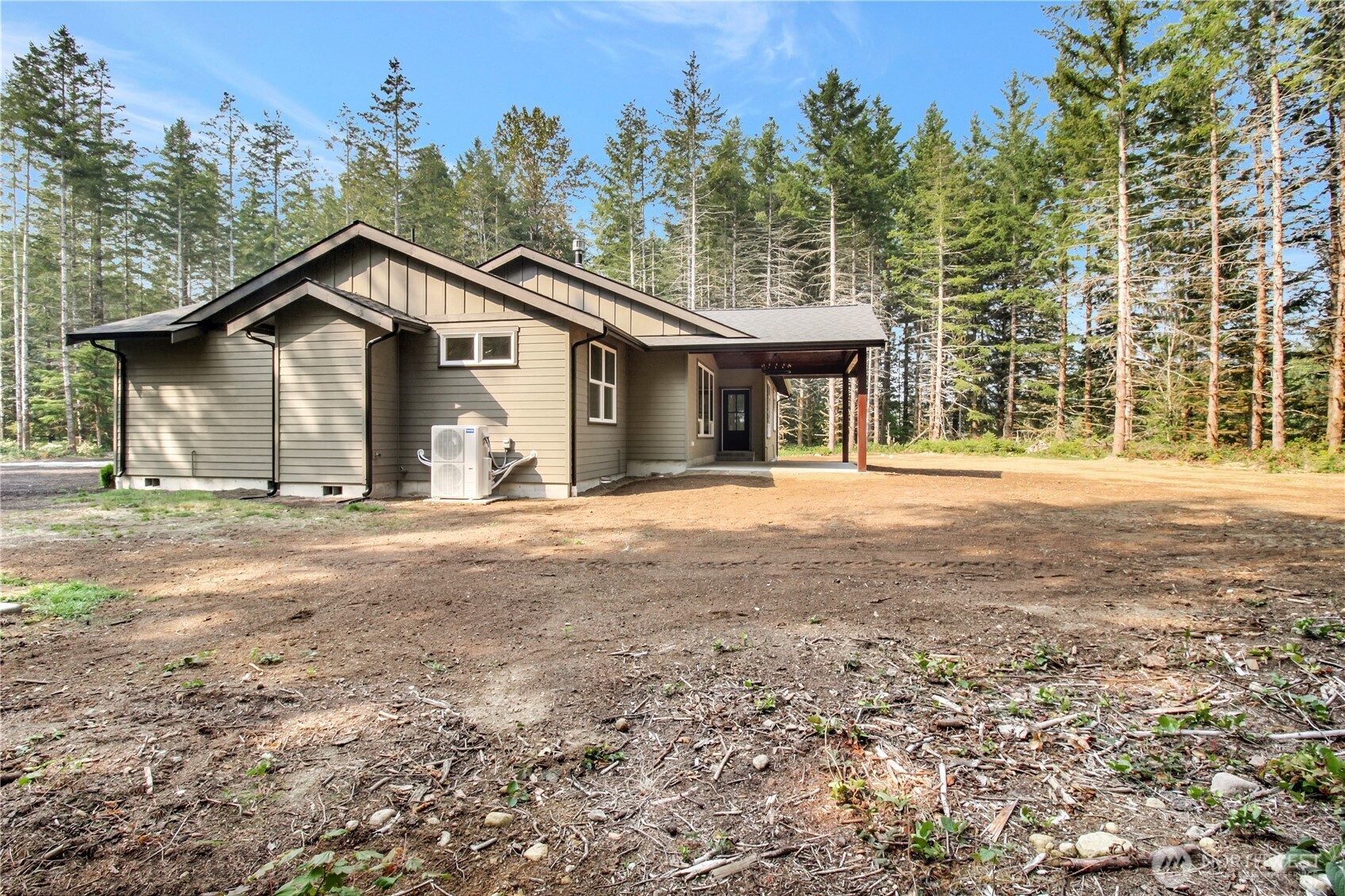36817 State Rte 530 Northeast Arlington, WA 98223 - Photo 33 of 40 a front view of a house with a yard and garage