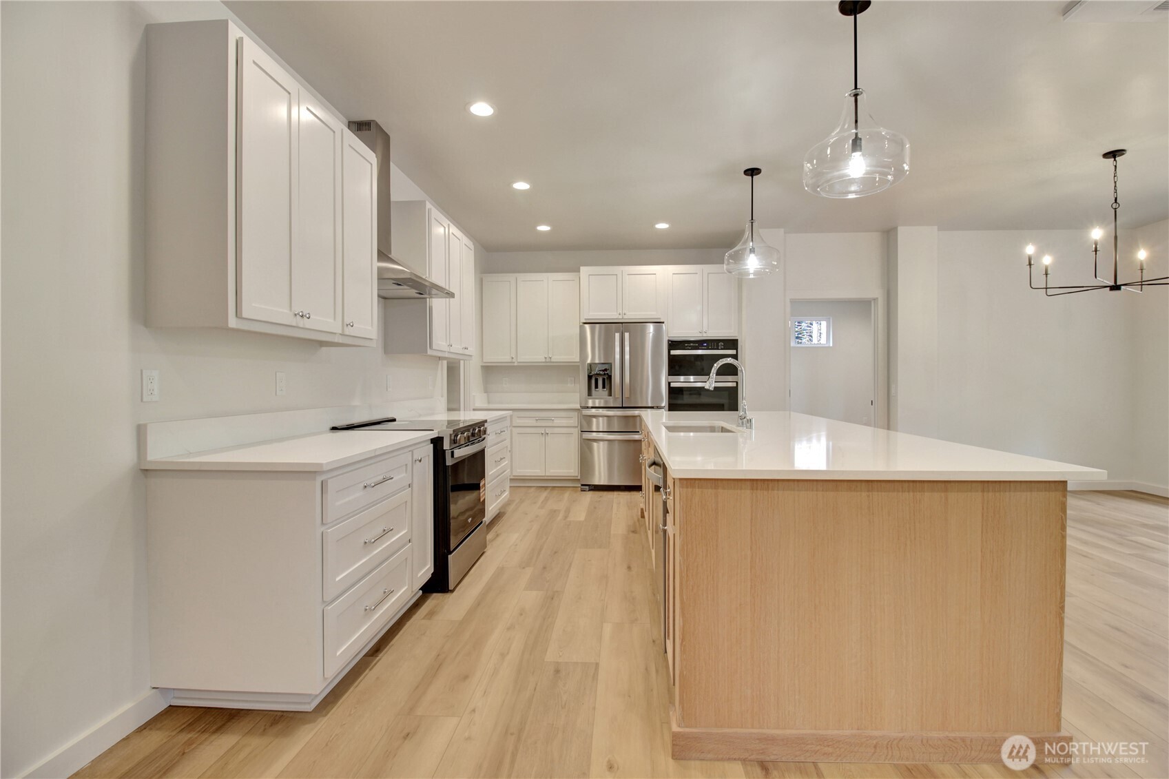 36817 State Rte 530 Northeast Arlington, WA 98223 - Photo 8 of 40 a large kitchen with stainless steel appliances kitchen island a large counter top and a stove top oven
