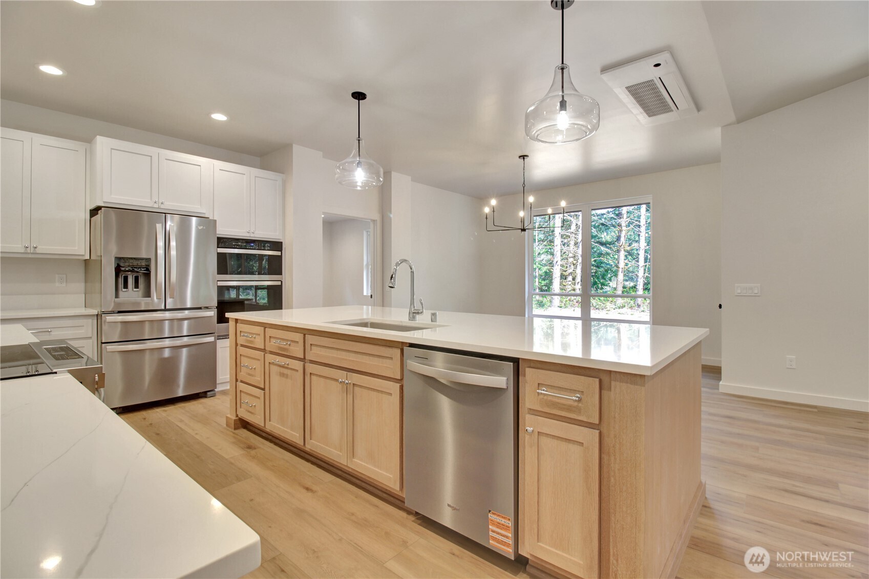 36817 State Rte 530 Northeast Arlington, WA 98223 - Photo 9 of 40 a kitchen with granite countertop a sink stainless steel appliances and counter space