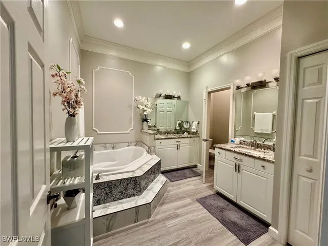 a bathroom with a double vanity sink mirror and shower