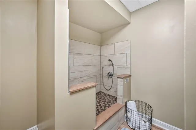 a bathroom with a sink a toilet and shower curtain