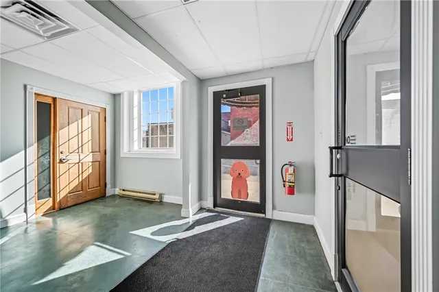 a view of livingroom with furniture window and front door