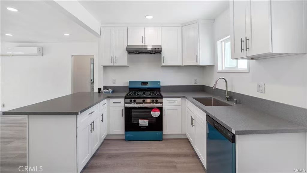 4249 Filhurst Avenue Baldwin Park, CA 91706 - Photo 10 of 24 a kitchen with stainless steel appliances granite countertop a sink stove and refrigerator