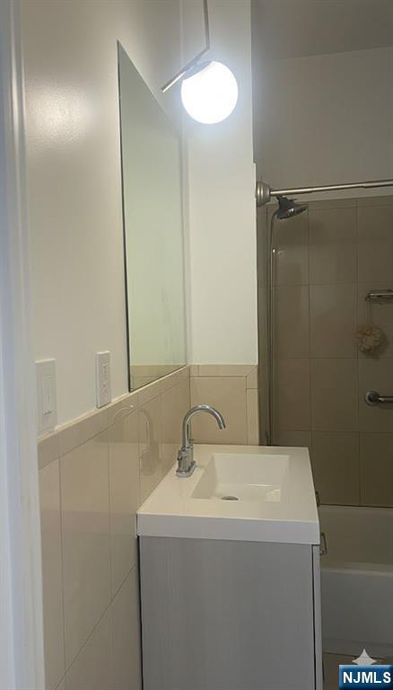 230 Lakeview Avenue, Unit 2 Clifton, NJ 07011 - Photo 2 of 5 a bathroom with a sink and a mirror