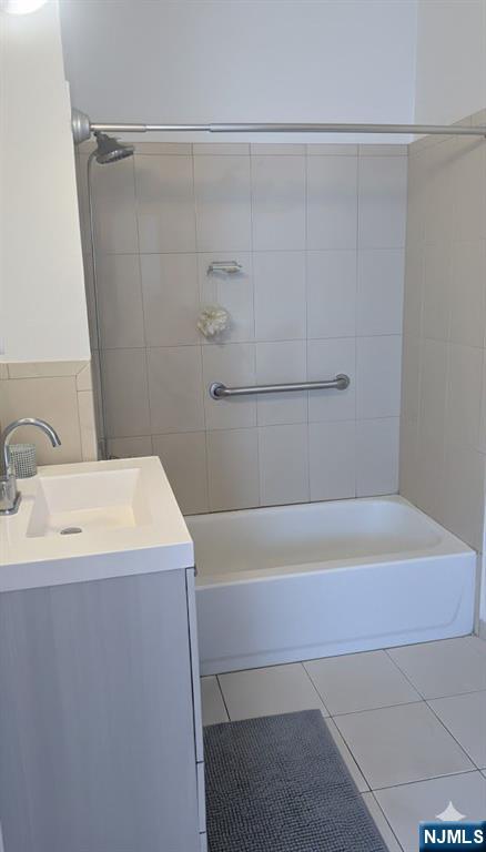 230 Lakeview Avenue, Unit 2 Clifton, NJ 07011 - Photo 3 of 5 a bathroom with a tub a sink and a shower