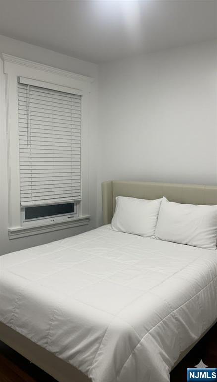 230 Lakeview Avenue, Unit 2 Clifton, NJ 07011 - Photo 4 of 5 a bedroom with a bed and a window