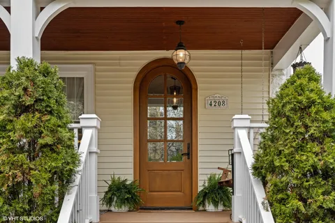 a front view of a house with outdoor seating