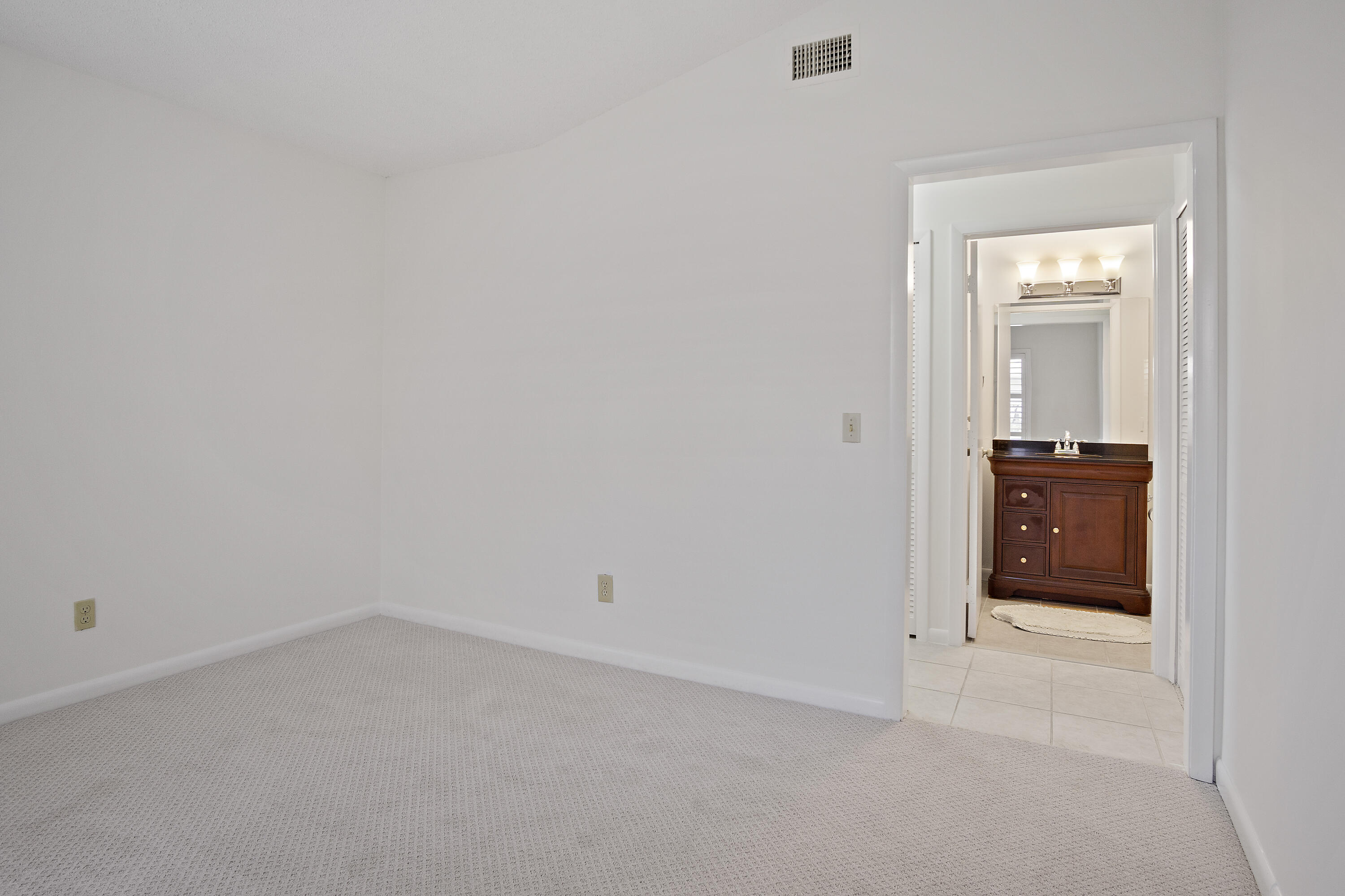 3782 Southeast Canvas Back Place Stuart, FL 34997 - Photo 13 of 19 wooden floor and cabinet in an empty room