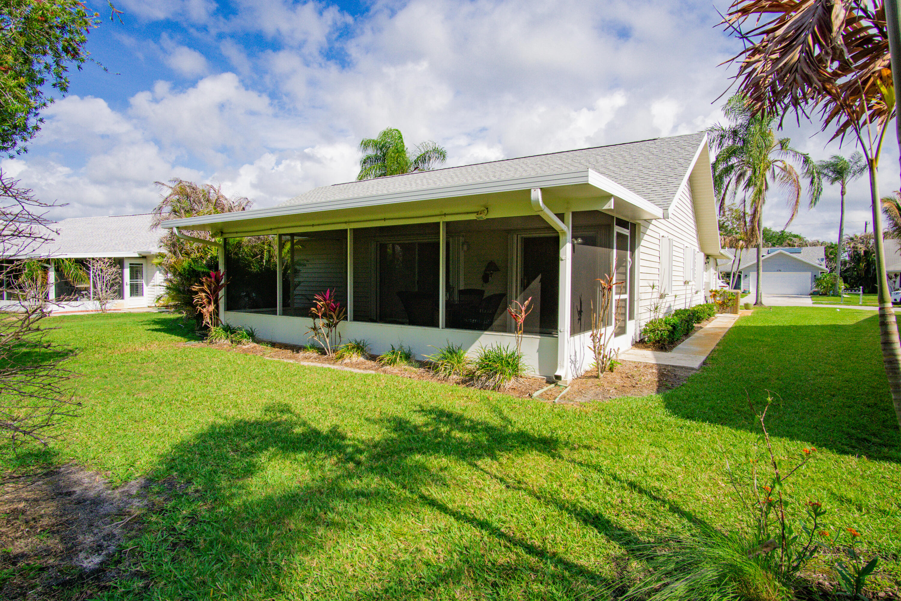 3782 Southeast Canvas Back Place Stuart, FL 34997 - Photo 17 of 19 front view of a house with a yard