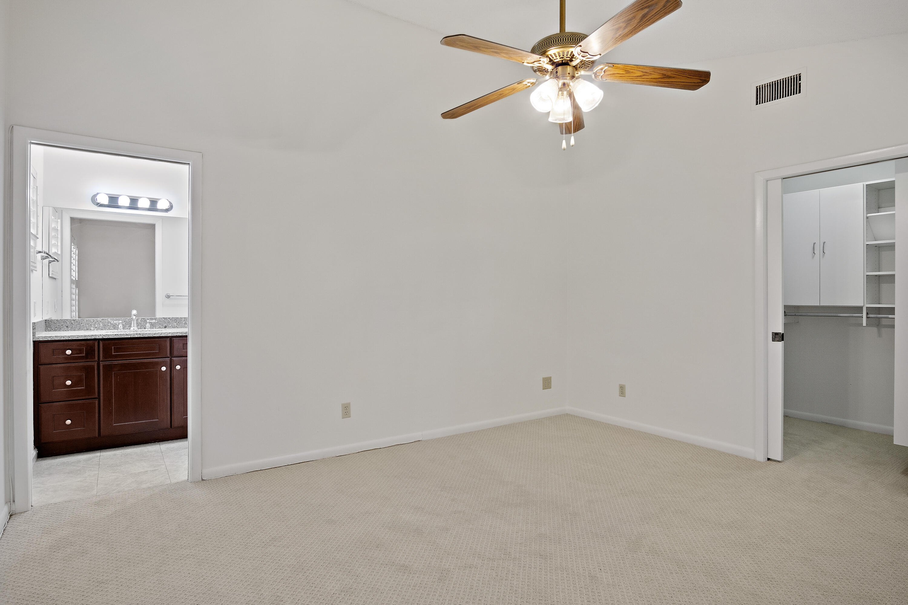 3782 Southeast Canvas Back Place Stuart, FL 34997 - Photo 8 of 19 an empty room with closet and fan