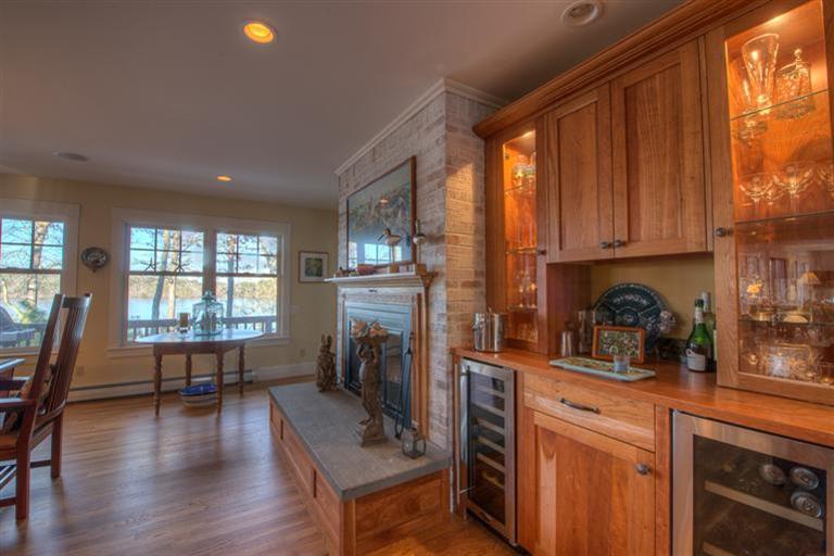 133 Lovells Road Cotuit, MA 02635 - Photo 11 of 27 a kitchen with sink cabinets and wooden floor
