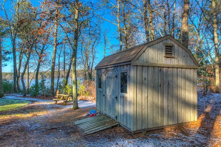 133 Lovells Road Cotuit, MA 02635 - Photo 22 of 27 a backyard of a house with lots of green space