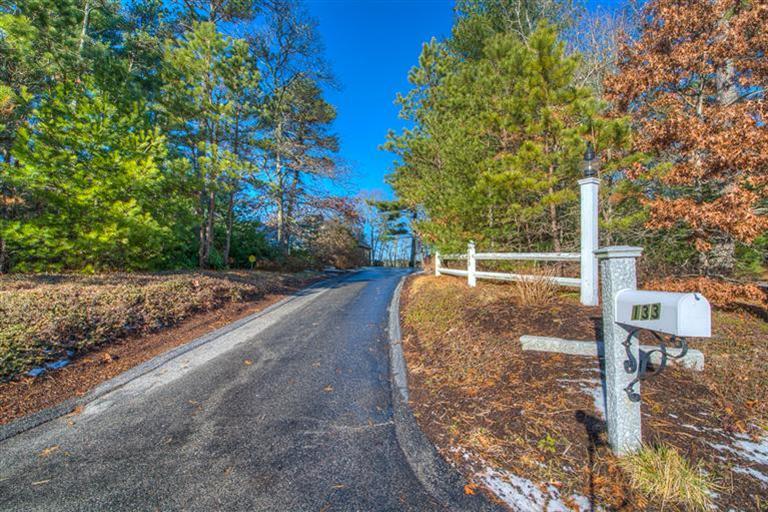 133 Lovells Road Cotuit, MA 02635 - Photo 23 of 27 a view of a street with large trees