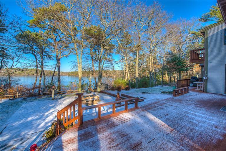 133 Lovells Road Cotuit, MA 02635 - Photo 24 of 27 a view of a backyard with sitting area