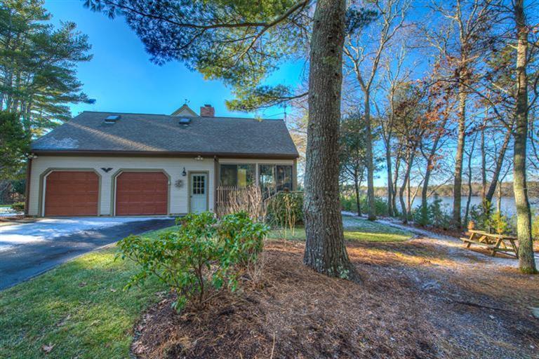 133 Lovells Road Cotuit, MA 02635 - Photo 26 of 27 a front view of a house with garden