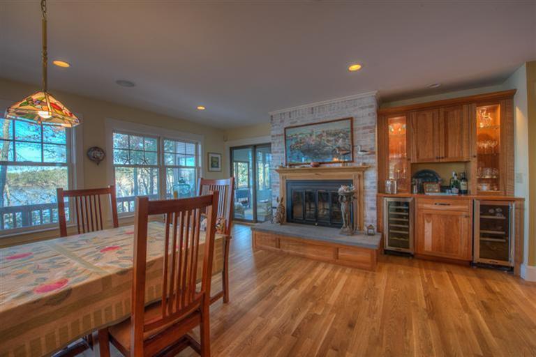 133 Lovells Road Cotuit, MA 02635 - Photo 6 of 27 a living room with furniture and a fireplace