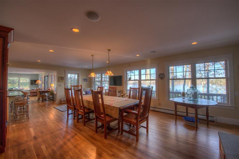 133 Lovells Road Cotuit, MA 02635 - Photo 10 of 27 a view of a dining room with furniture window and wooden floor