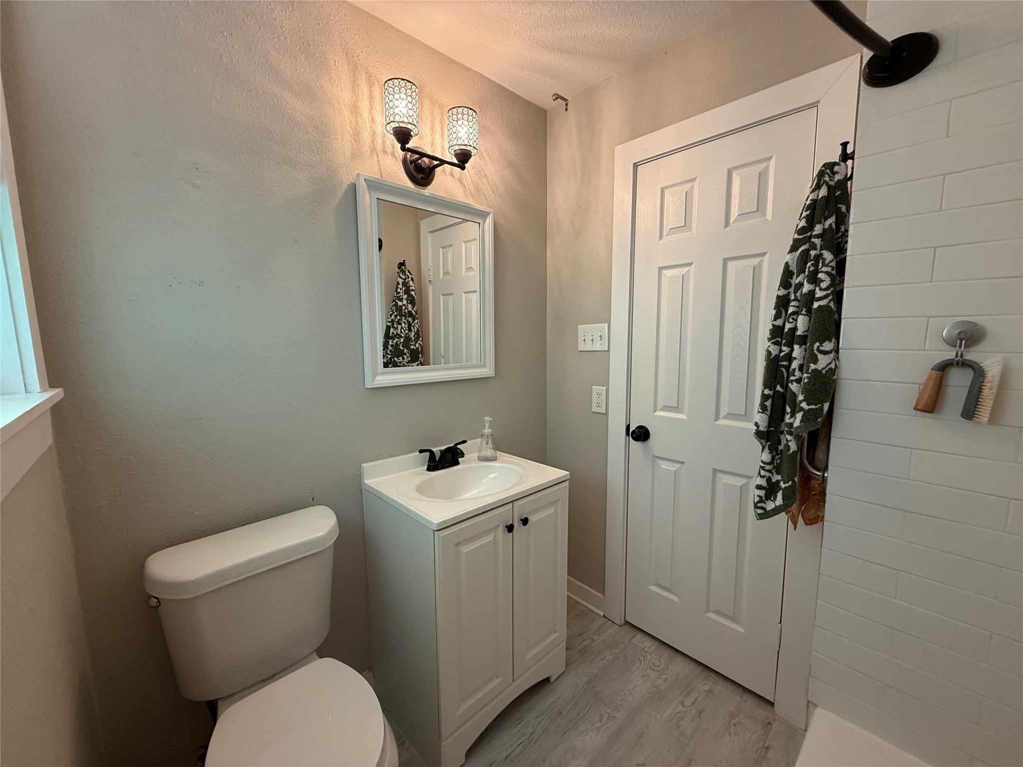 2005 Magnolia Drive La Marque, TX 77568 - Photo 11 of 15 a bathroom with a toilet a sink and mirror
