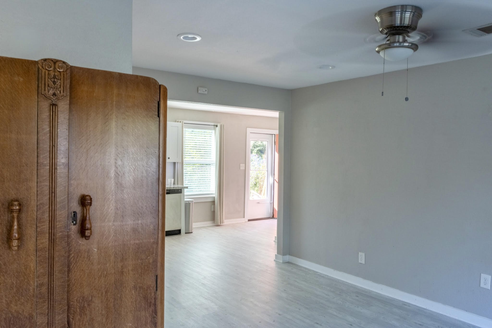 2005 Magnolia Drive La Marque, TX 77568 - Photo 5 of 15 a view of a hallway with wooden floor and a cabinet