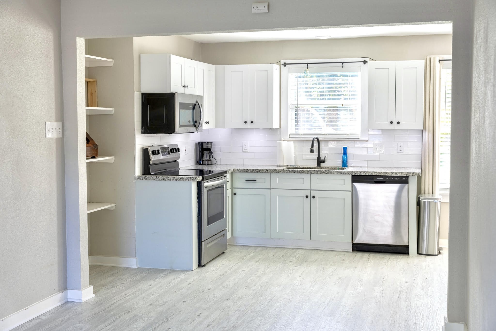 2005 Magnolia Drive La Marque, TX 77568 - Photo 6 of 15 a kitchen with white cabinets and white appliances
