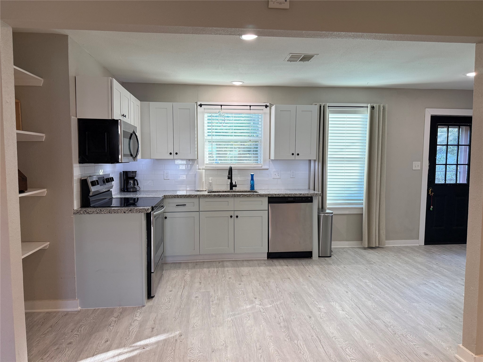 2005 Magnolia Drive La Marque, TX 77568 - Photo 8 of 15 a kitchen with a sink cabinets and wooden floor