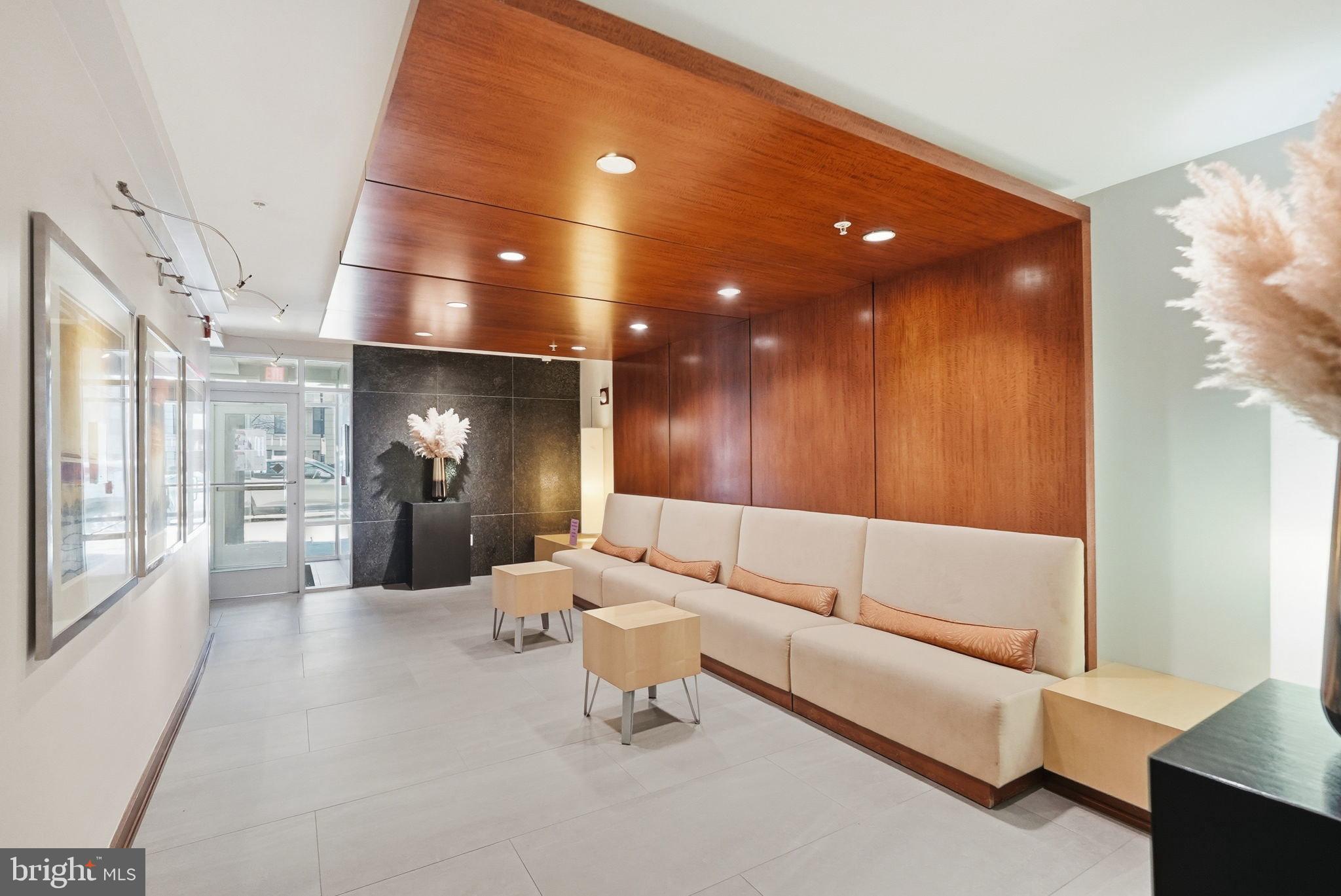 1209 13th Street Northwest, Unit 208 Washington, DC 20005 - Photo 15 of 22 a living room with furniture and a large window