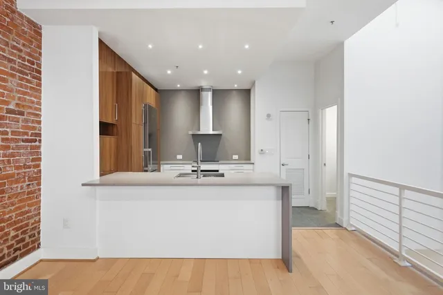 a kitchen with a refrigerator and a stove