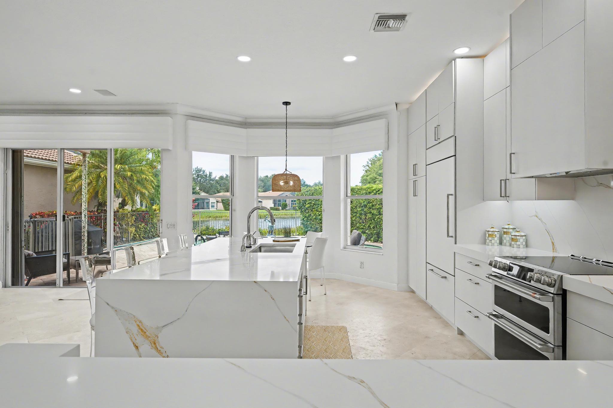 6416 Punta Rosa Drive Delray Beach, FL 33446 - Photo 8 of 37 KITCHEN TO OUTDOORS