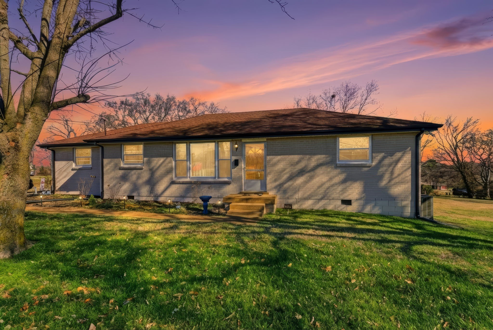608 Hamblen Drive Madison, TN 37115 - Photo 1 of 27 a view of a backyard with table and chairs and potted plants