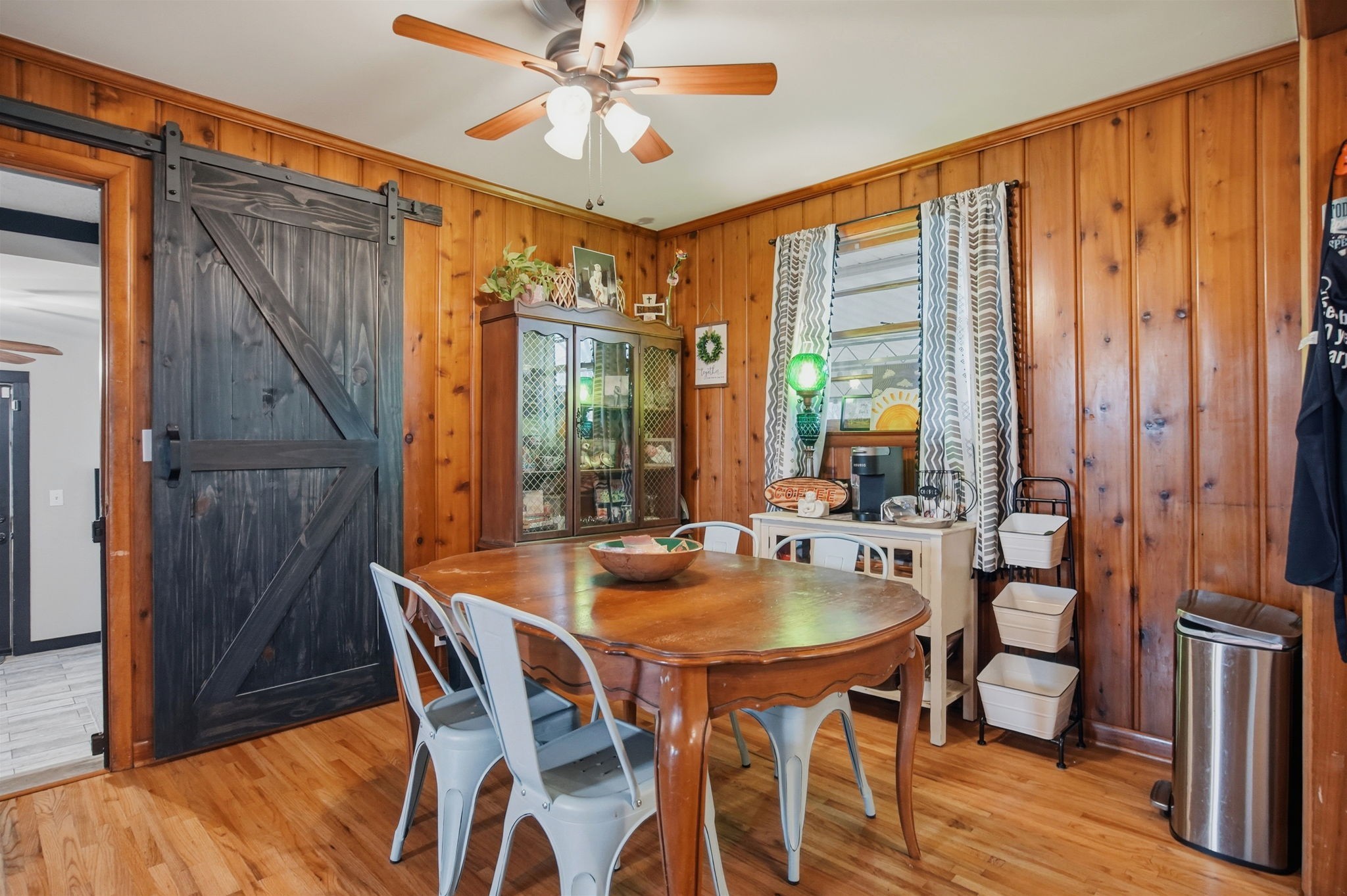 608 Hamblen Drive Madison, TN 37115 - Photo 11 of 27 a dining room with furniture a chandelier and wooden floor