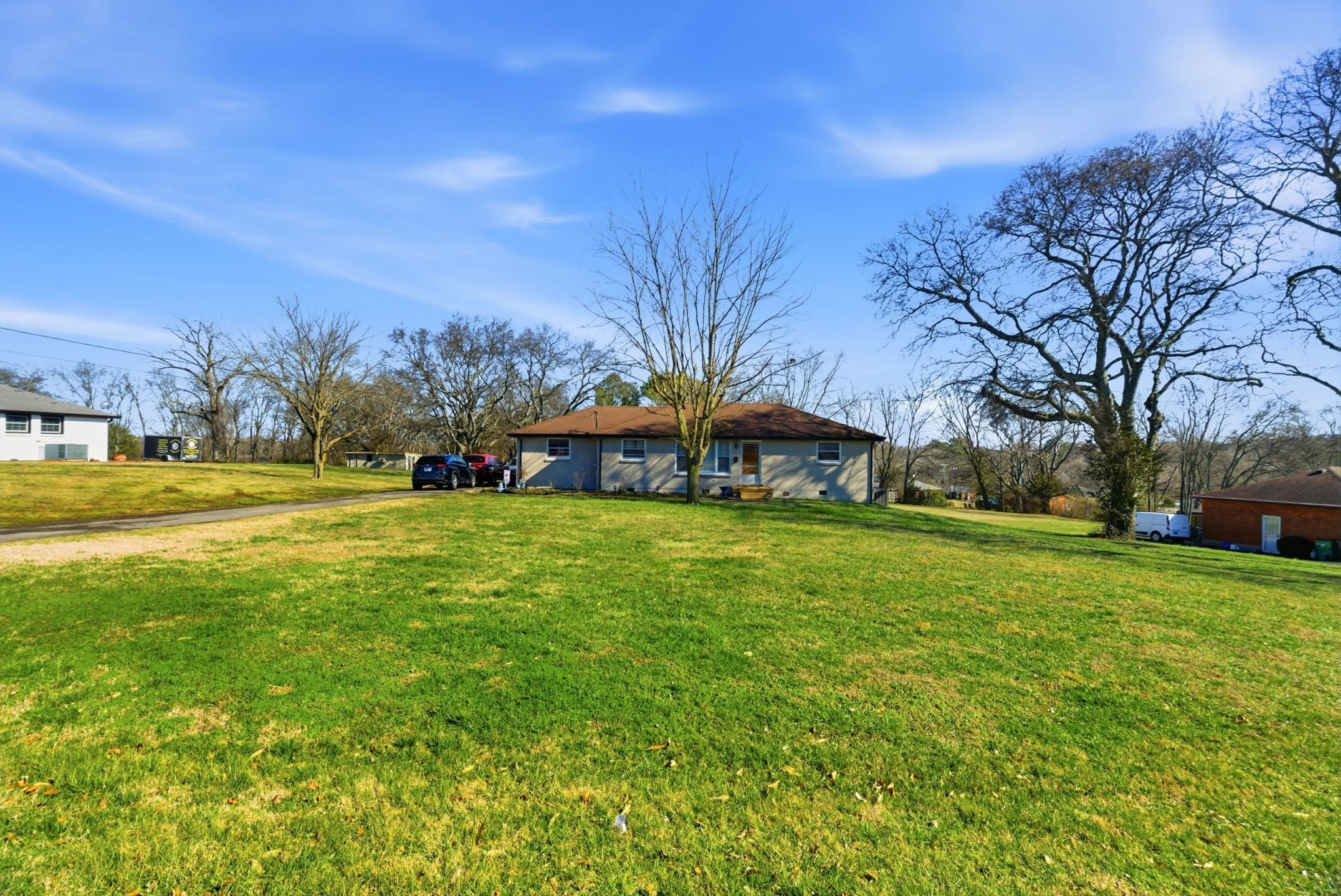 608 Hamblen Drive Madison, TN 37115 - Photo 3 of 27 a view of a yard with plants and trees
