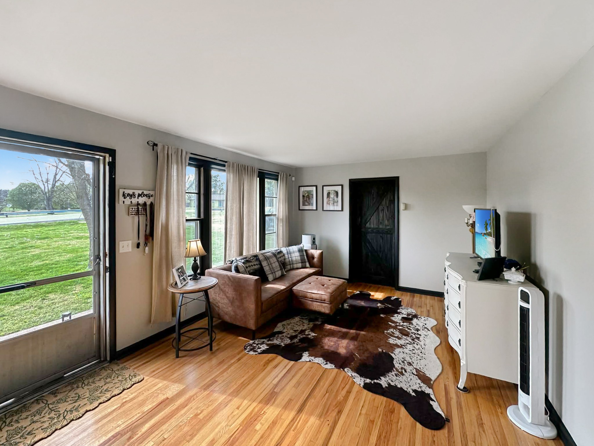 608 Hamblen Drive Madison, TN 37115 - Photo 4 of 27 a bedroom with a bed and large windows
