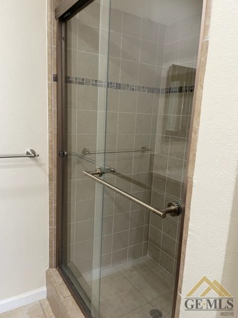 Undisclosed Address Bakersfield, CA 93311 - Photo 16 of 20 a bathroom with a glass shower door