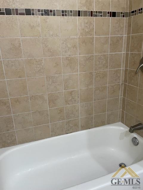 Undisclosed Address Bakersfield, CA 93311 - Photo 18 of 20 a bathroom with a bathtub